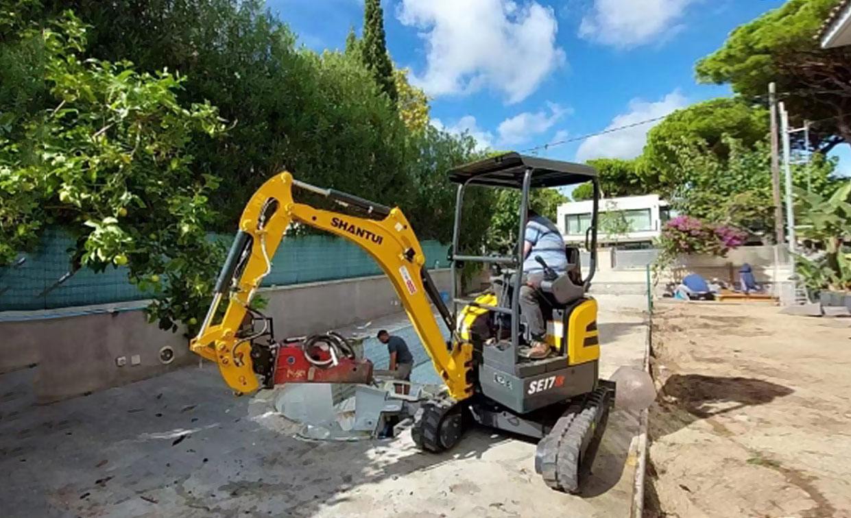 Shantui SE17SR mini excavator works in Spain.